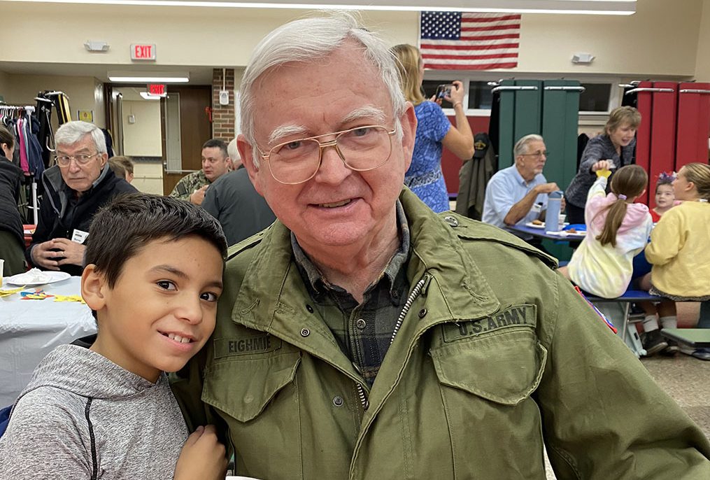 Student hugs a veteran